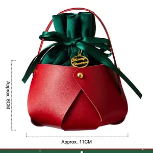 Red faux leather Christmas apple gift bag with green velvet drawstring and gold tag