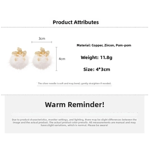Detail showing white fur ball earrings with golden zircon bows and size specifications