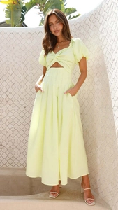 Detail of short puff sleeves and stylish cut-out knot design on this lemon yellow summer dress