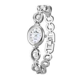 Detailed close-up of a silver watch with mother-of-pearl dial and inlaid white pearls