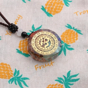 Chakra Orgone energy necklace with 7-color crystals and OM symbol on a woven cord