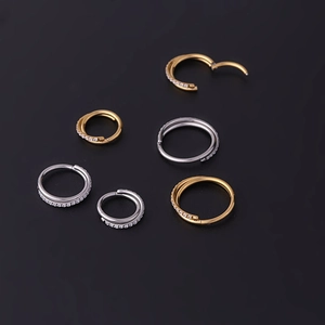 Crossed seamless stainless steel hinged rings with zircon inlay in gold and silver set