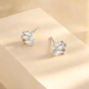 Detail view of silver stud earrings featuring three marquise-cut marquise zircons