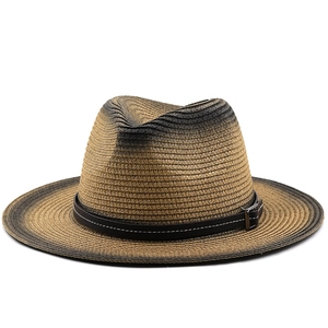 Detail of the woven texture and dark leather band on this gradient straw jazz hat