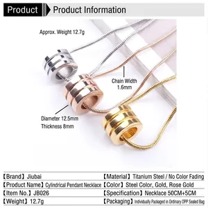 Three titanium steel cylinder pendant necklaces in gold, silver, and rose gold on marble