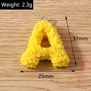 Macro detail of yellow resin rose-flower alphabet A pendant with 32mm size specifications