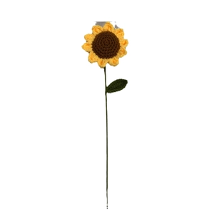 Handcrafted crochet sunflower with yellow petals and green stem on white background