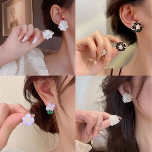 Elegant floral stud earrings collection featuring white petals, camellia style, and pearls