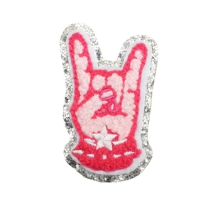 Pink rock gesture embroidery patch with sequin trim and white stars on a white background