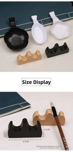 Detailed view of three-peak brush rest and plastic ink dish for calligraphy practice