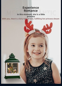 Child holding green vintage Christmas street lamp with miniature snow scene inside