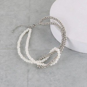 Detail of silver beads and white pearls stitching on double-layer necklace jewelry