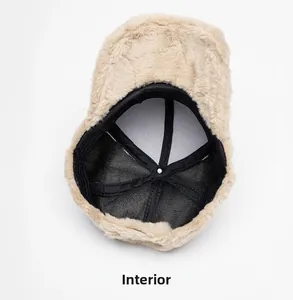 Detail view of the khaki faux rabbit fur baseball cap showing black inner lining and sweatband