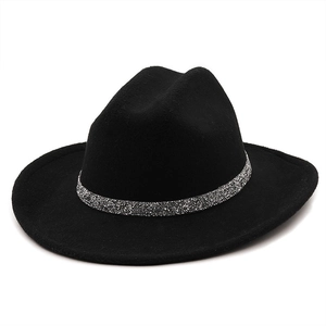 Close-up of a black wool fedora featuring a shiny silver sequined decorative chain band