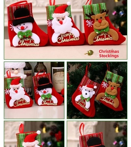 Detail of Christmas stocking with 3D Santa, reindeer and snowman plush designs