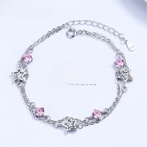 Close-up of S925 sterling silver double-layer bracelet with star and pink gemstone