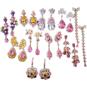 Sparkling zircon butterfly and heart tassel earrings with colorful drop stones on white background