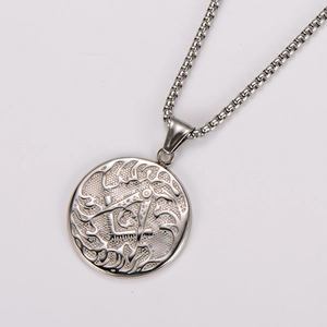 Close-up of vintage stainless steel Freemason pendant with compass and square relief detail