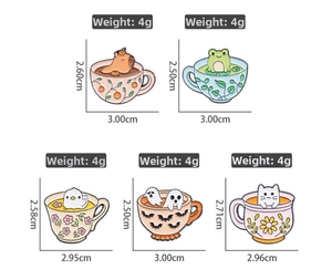 Detail view of five cute animal enamel pins in teacups, weight 4g per badge