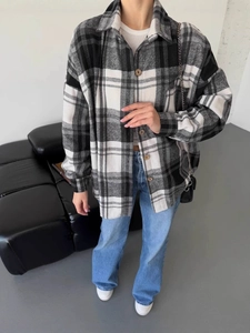 Women's plaid long-sleeve button-down flannel shirt in black and white check pattern