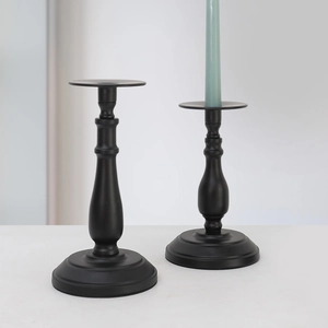 Minimalist black metal candle holders set in matte finish for elegant home table decor