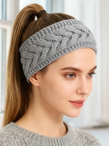 Detail of grey cable knit headband featuring thick braided texture and soft thermal lining