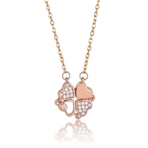Macro shot of rose gold necklace featuring heart-shaped clovers with micro zircons