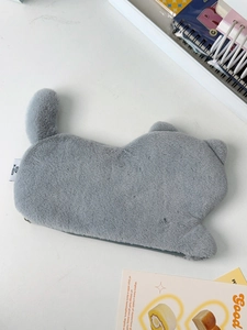 Detail of grey plush cat pencil case showing soft faux fur texture and hidden zipper