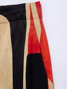 Macro shot of geometric color-block pattern fabric on two-piece commuter print set