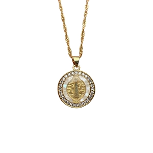 Gold Guadalupe Saint Benedict necklace with white shell pendant and zircon stones