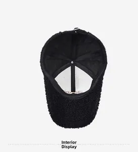 Detailed view of the six-panel interior stitching and warm fleece lining of the black cap