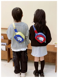 Detail view of cartoon car waist bags with adjustable straps on two young children