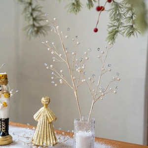 Creative Christmas gold pearl crystal branches in a frosted vase for festive table decor
