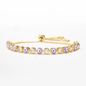 Detail of evil eye bracelet with purple enamel beads and sparkling cubic zirconia stones