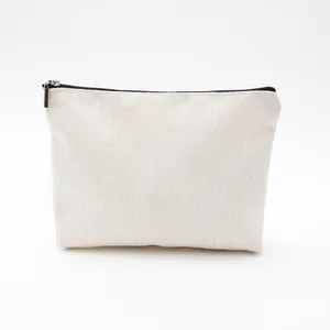 Detail of canvas toiletry bag featuring a sturdy black zipper and textured fabric