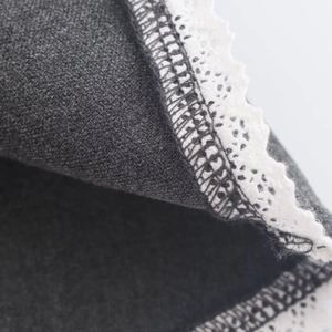 Short dark gray velvet dress with white lace trim and backless minimalist style