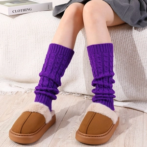 Purple cable-knit leg warmers with brown faux fur clogs for a cozy winter look