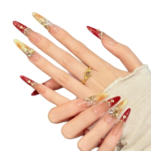 Handmade red and gold glitter press-on nails with 3D metal butterfly and pearl charms