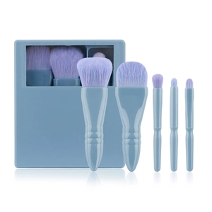 Close-up of a 5-piece travel makeup brush set with purple bristles and mirror storage case