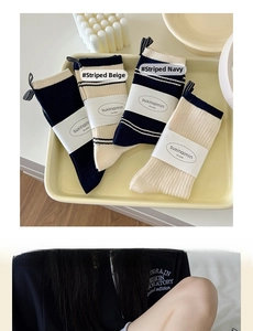 Close-up of Japanese style cotton socks with striped and contrast patterns on a tray