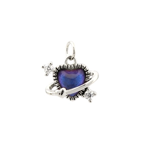 Macro detail of heart-shaped planet pendant with purple-blue gradient and zircon accents