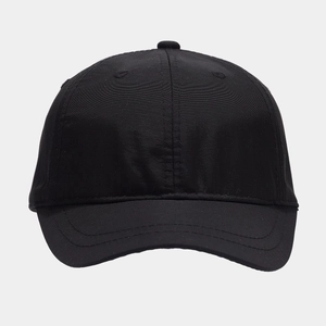 Detail view of the breathable fabric and six-panel crown of a black waterproof baseball cap