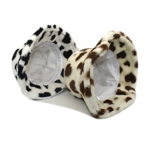 Detailed view of plush cow print bucket hats showing warm faux fur and soft inner lining