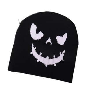Black knitted beanie featuring a white spooky pumpkin smile for Halloween streetwear