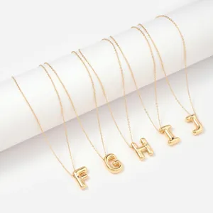 Gold bubble initial necklaces with letters F to J in minimalist stainless steel style