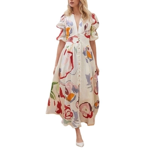 Detail of V-neck long dress with colorful abstract print and button-up puff sleeves