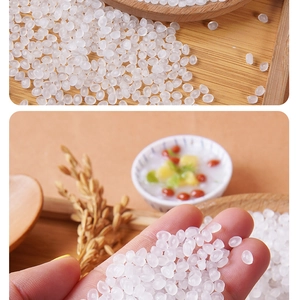Close-up of translucent white resin rice beads for DIY slime and craft filling