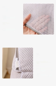 Detail of breathable honeycomb mesh laundry bag with secure locking grey zipper