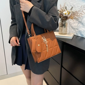 Brown geometric quilted crossbody bag with mini coin purse and gold tassel accent