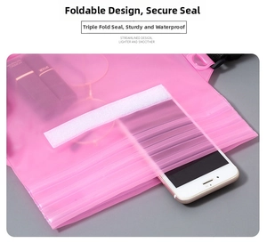 Pink waterproof pouch detail showing triple fold seal and internal storage for mobile phone